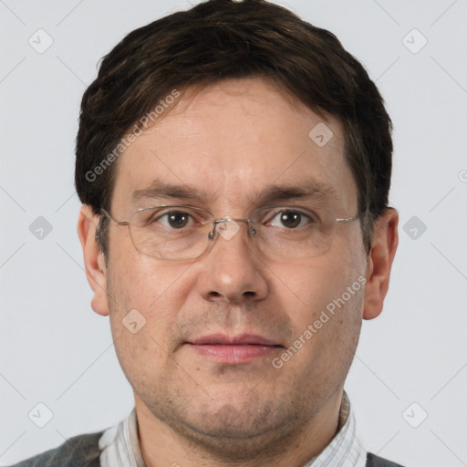 Joyful white adult male with short  brown hair and brown eyes