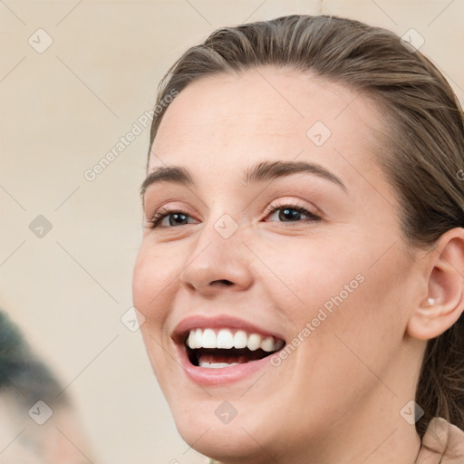 Joyful white young-adult female with medium  brown hair and blue eyes