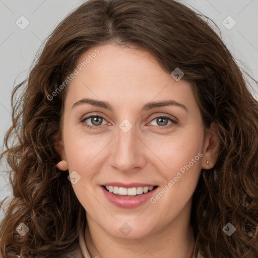 Joyful white young-adult female with long  brown hair and green eyes