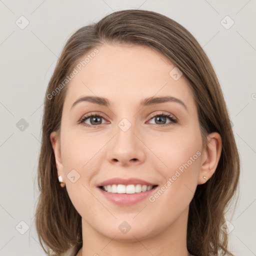 Joyful white young-adult female with medium  brown hair and grey eyes