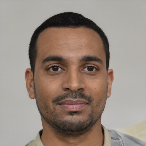 Neutral black young-adult male with short  black hair and brown eyes