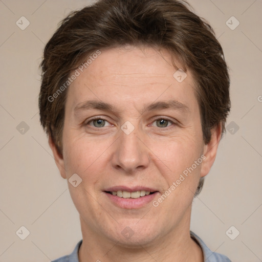 Joyful white adult male with short  brown hair and grey eyes