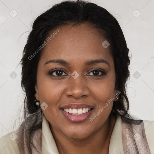 Joyful black young-adult female with long  brown hair and brown eyes