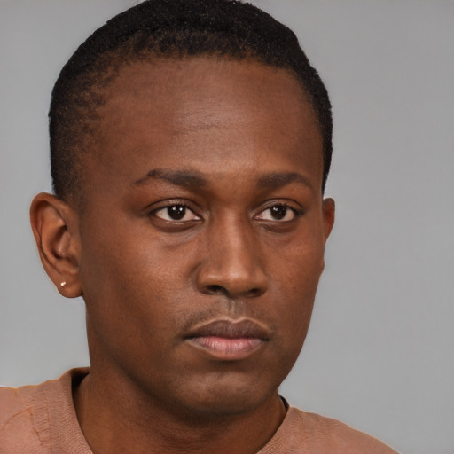 Neutral black young-adult male with short  brown hair and brown eyes