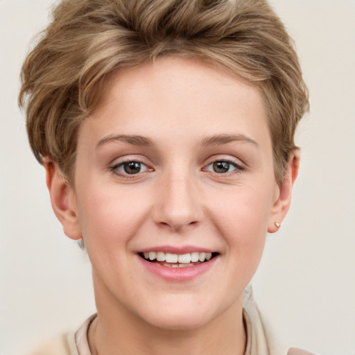 Joyful white young-adult female with short  brown hair and grey eyes