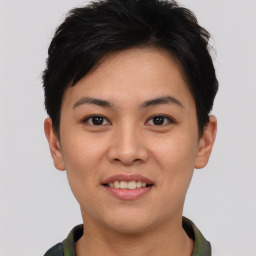 Joyful asian young-adult female with short  brown hair and brown eyes