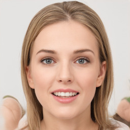 Joyful white young-adult female with long  brown hair and green eyes