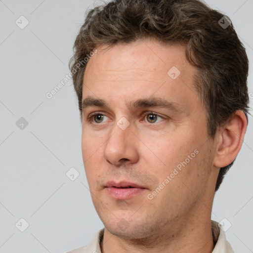 Neutral white adult male with short  brown hair and brown eyes