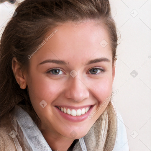 Joyful white young-adult female with long  brown hair and blue eyes