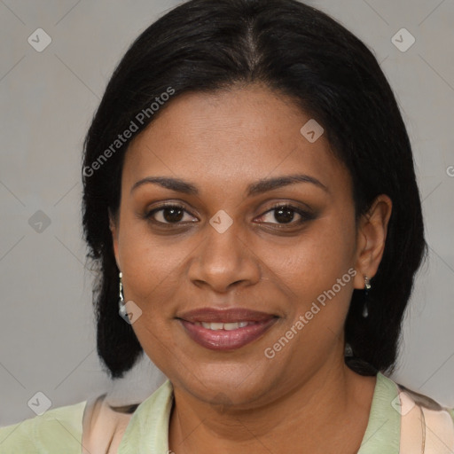 Joyful black adult female with medium  brown hair and brown eyes