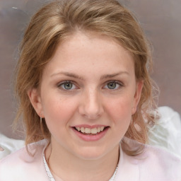 Joyful white young-adult female with medium  brown hair and blue eyes