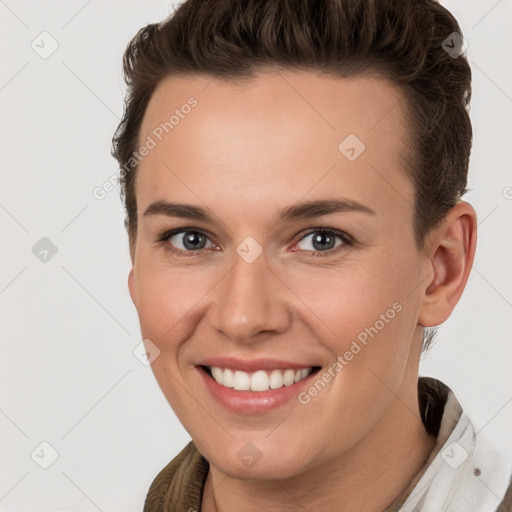 Joyful white young-adult female with short  brown hair and brown eyes