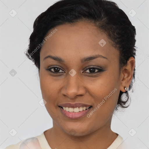 Joyful black young-adult female with short  brown hair and brown eyes