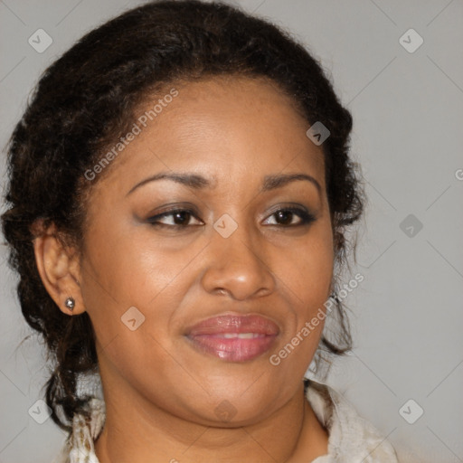 Joyful black adult female with medium  brown hair and brown eyes