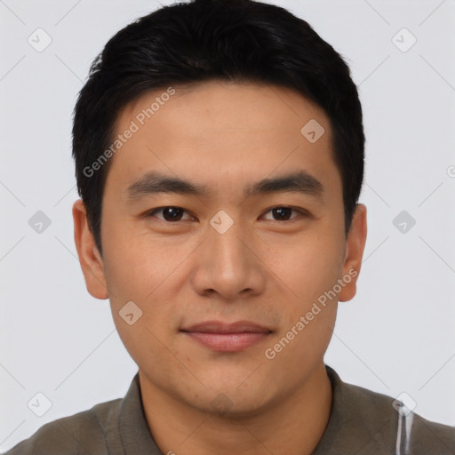 Joyful asian young-adult male with short  black hair and brown eyes