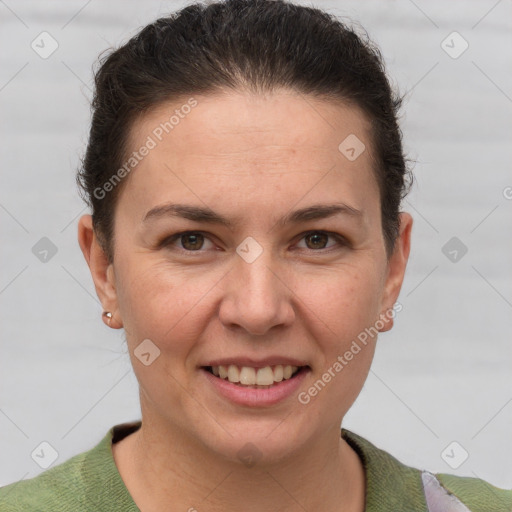 Joyful white adult female with short  brown hair and grey eyes