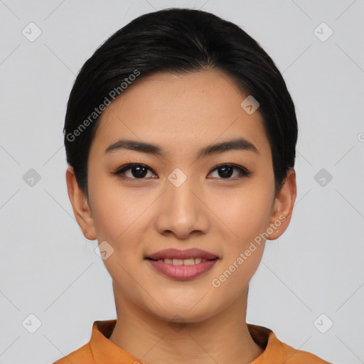 Joyful asian young-adult female with short  black hair and brown eyes