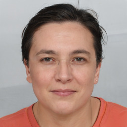 Joyful white adult female with short  brown hair and brown eyes