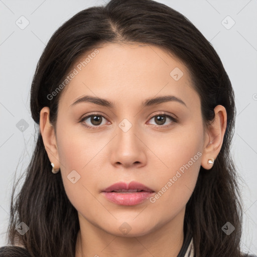 Neutral white young-adult female with long  brown hair and brown eyes