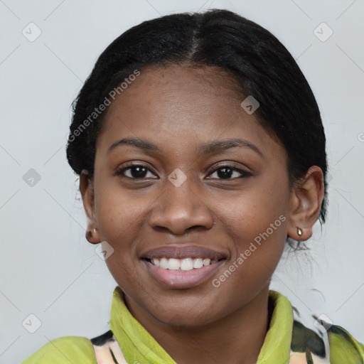 Joyful black young-adult female with medium  black hair and brown eyes