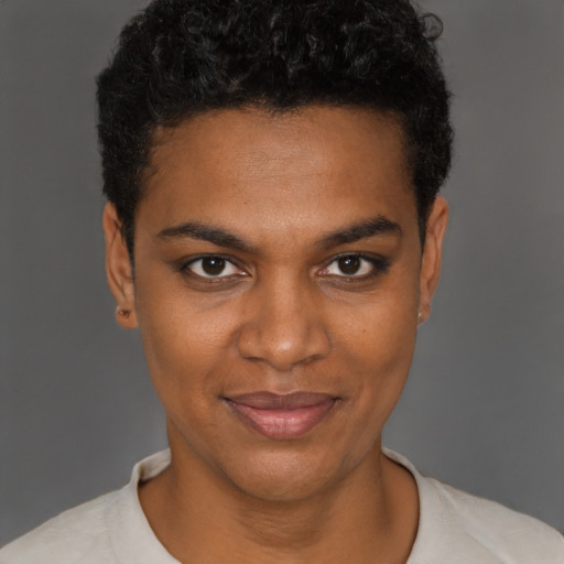 Joyful black young-adult female with short  brown hair and brown eyes