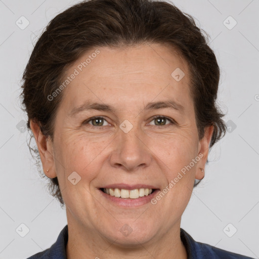 Joyful white adult female with short  brown hair and brown eyes