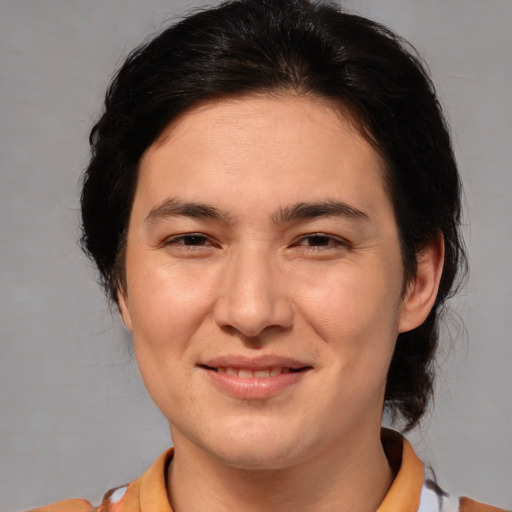 Joyful white adult female with medium  brown hair and brown eyes