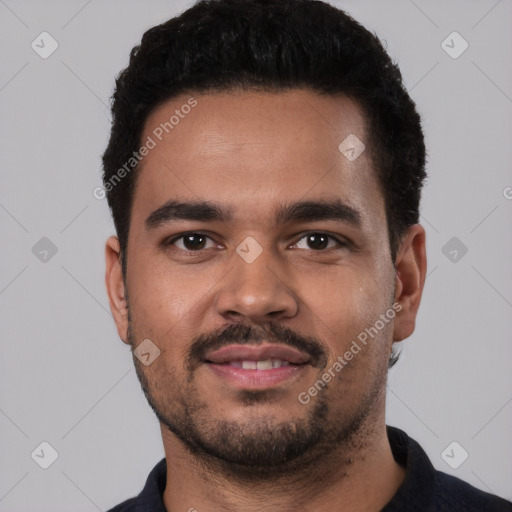 Joyful latino young-adult male with short  black hair and brown eyes