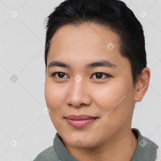 Joyful asian young-adult male with short  brown hair and brown eyes