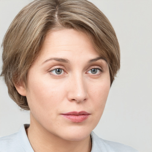 Neutral white young-adult female with medium  brown hair and grey eyes