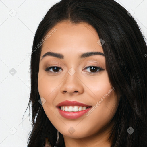 Joyful latino young-adult female with long  black hair and brown eyes