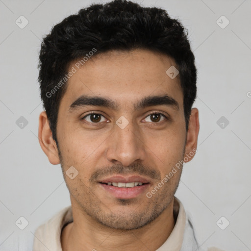 Joyful white young-adult male with short  black hair and brown eyes