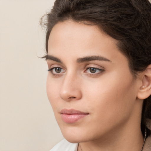 Neutral white young-adult female with long  brown hair and brown eyes