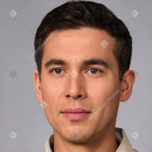 Joyful white young-adult male with short  brown hair and brown eyes