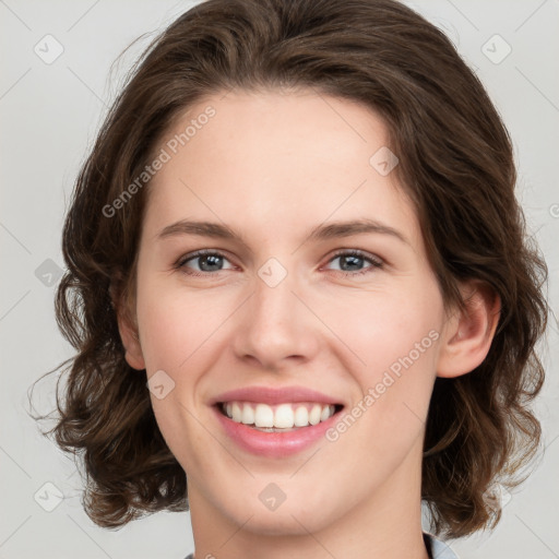 Joyful white young-adult female with medium  brown hair and green eyes