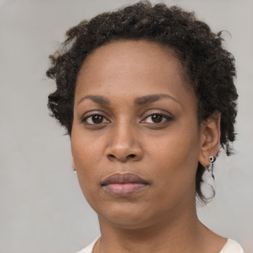 Neutral black young-adult female with short  brown hair and brown eyes