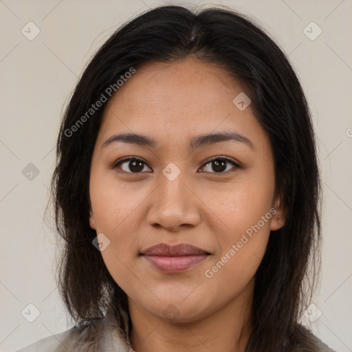 Joyful latino young-adult female with medium  brown hair and brown eyes