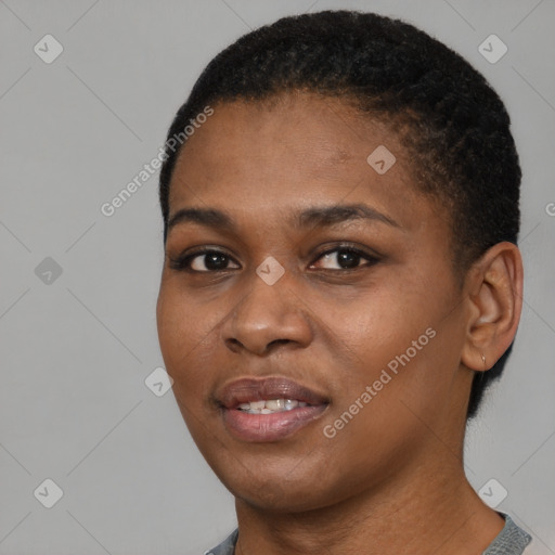 Joyful black young-adult female with short  black hair and brown eyes