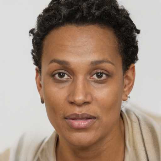 Neutral black adult female with short  brown hair and brown eyes