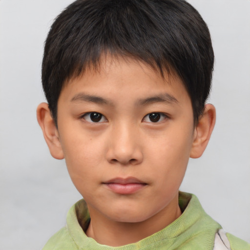 Neutral asian child male with short  brown hair and brown eyes