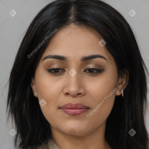 Joyful latino young-adult female with long  brown hair and brown eyes