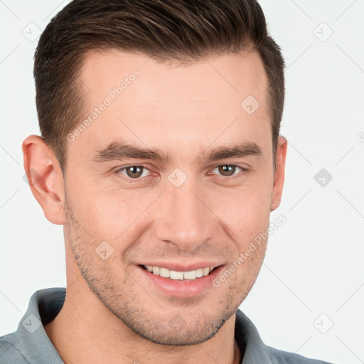 Joyful white young-adult male with short  brown hair and grey eyes