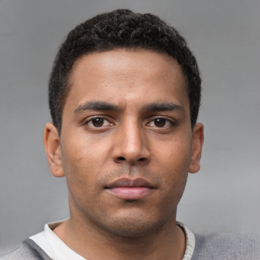Neutral black young-adult male with short  brown hair and brown eyes