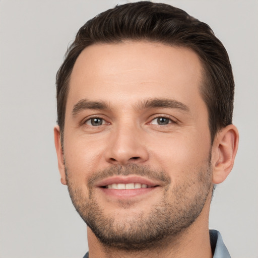 Joyful white young-adult male with short  brown hair and brown eyes