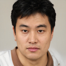 Neutral asian young-adult male with short  brown hair and brown eyes