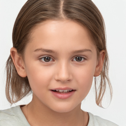 Joyful white child female with medium  brown hair and brown eyes