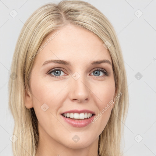 Joyful white young-adult female with long  brown hair and blue eyes