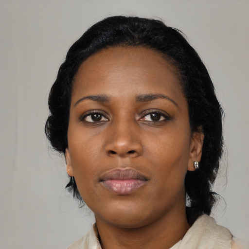 Neutral black young-adult female with medium  black hair and brown eyes