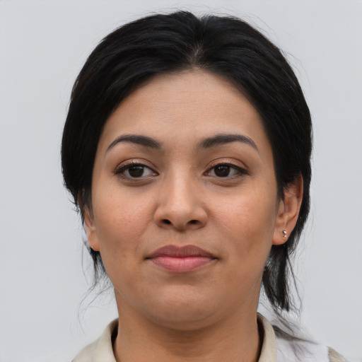 Joyful asian young-adult female with medium  black hair and brown eyes
