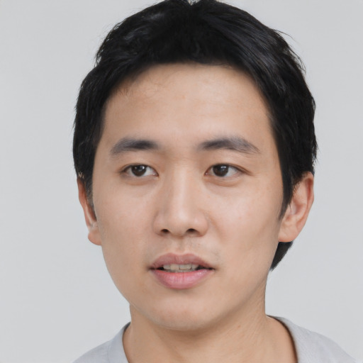 Neutral asian young-adult male with short  black hair and brown eyes